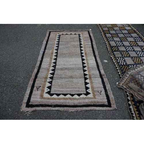 1063 - A Persian Gabbeh runner, 330cm x 110cm; together with a Gabbeh long rug, 232cm x 130cm.... 