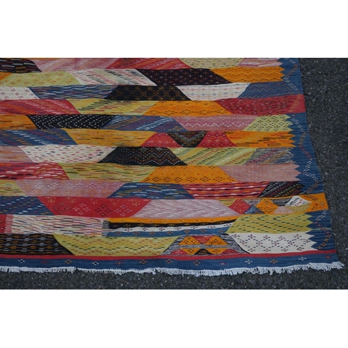 1066 - A Persian Shiraz flatweave rug, 298cm x 197cm.