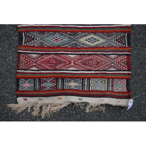 1067 - A small Caucasian rug, 93cm x 63cm. 