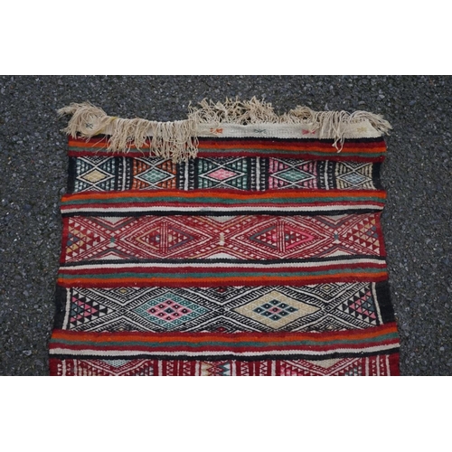 1067 - A small Caucasian rug, 93cm x 63cm. 