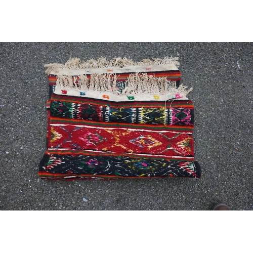 1067 - A small Caucasian rug, 93cm x 63cm. 