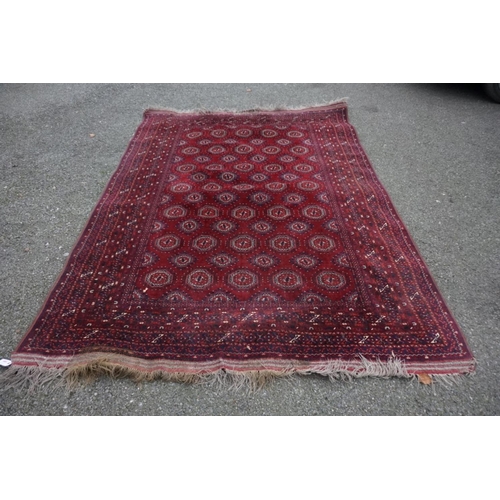 1069 - A Bokhara carpet, having repeated central field with geometric borders, 280cm x 208cm.... 