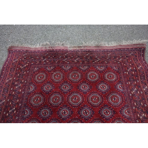 1069 - A Bokhara carpet, having repeated central field with geometric borders, 280cm x 208cm.... 