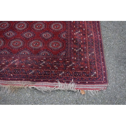 1069 - A Bokhara carpet, having repeated central field with geometric borders, 280cm x 208cm.... 