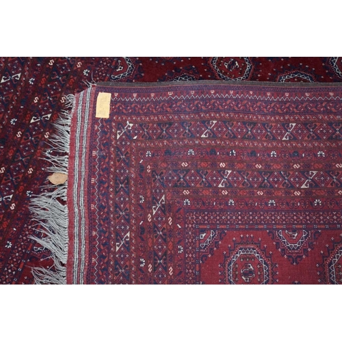 1069 - A Bokhara carpet, having repeated central field with geometric borders, 280cm x 208cm.... 