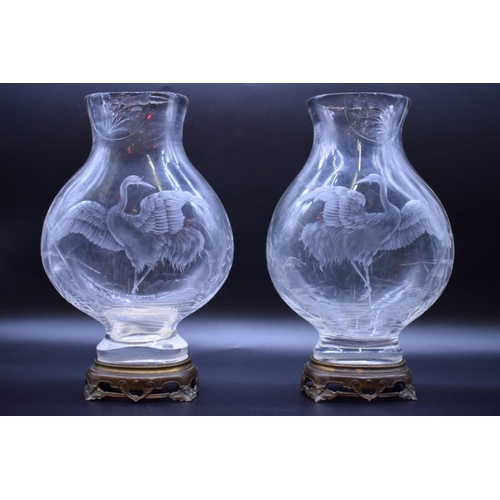 1412 - A good pair of late 19th century Baccarat rock crystal style cut glass vases, each finely engraved w...