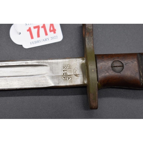 1714 - A US bayonet and steel scabbard, the blade dated 1913.