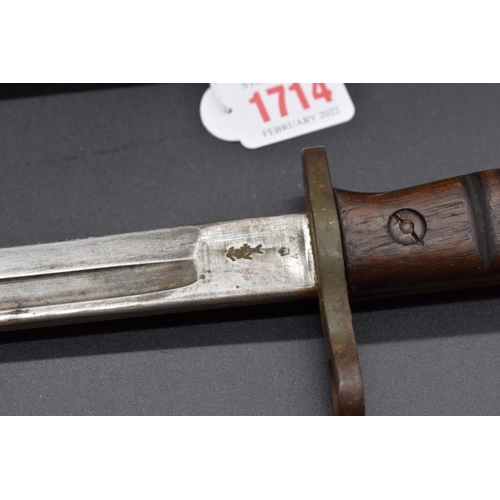 1714 - A US bayonet and steel scabbard, the blade dated 1913.