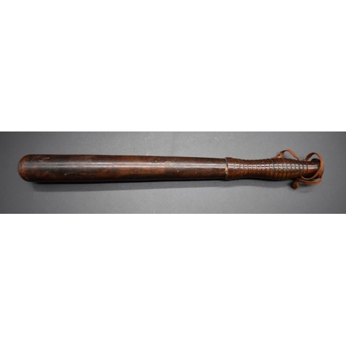 1715 - An antique truncheon, with ribbed handle, 40cm long. 