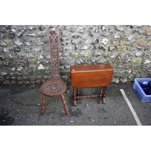 1060 - A carved oak spinning stool; together with a mahogany Sutherland table.