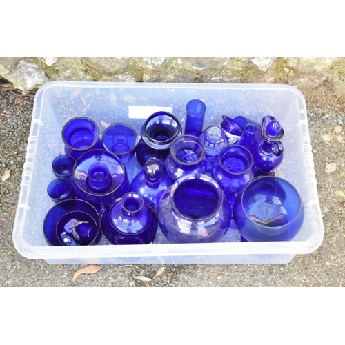 1061 - A quantity of blue glass.