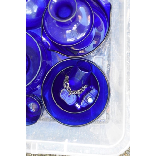 1061 - A quantity of blue glass.