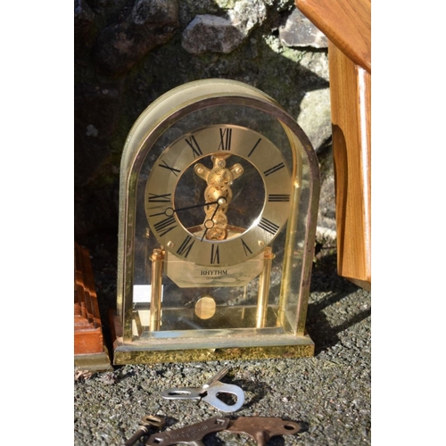 1062 - A Zench wall clock; together with a mantel clock and a Rhythm mantel clock.  ... 