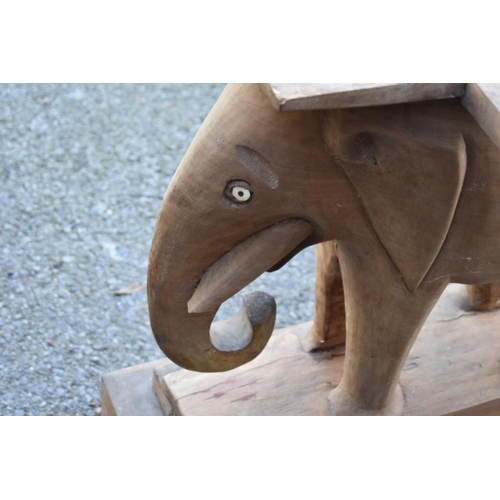 1064 - WITHDRAWN FROM SALE: A carved elephant table base.