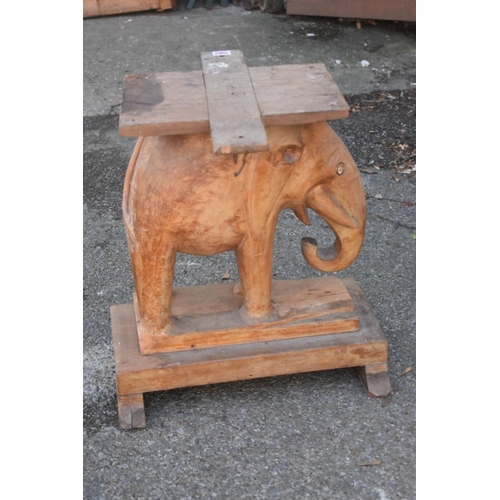 1064 - WITHDRAWN FROM SALE: A carved elephant table base.