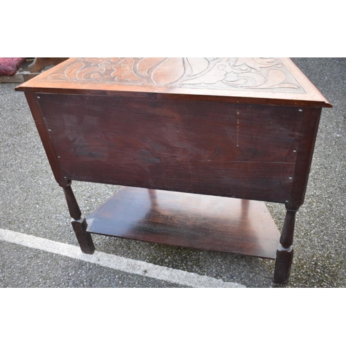 1066 - A 1960s carved oak table. 