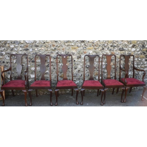 1069 - A set of six mahogany 1920s dining chairs; to include two carvers. 