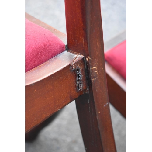 1069 - A set of six mahogany 1920s dining chairs; to include two carvers. 