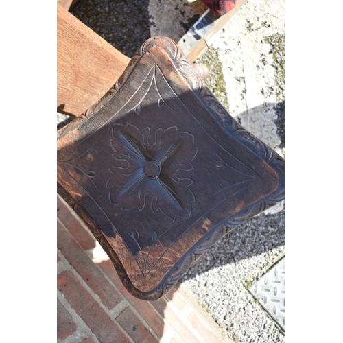 1071 - A carved oak prie dieu prayer desk; together with a Georgian oak tripod table and an oak stool.... 