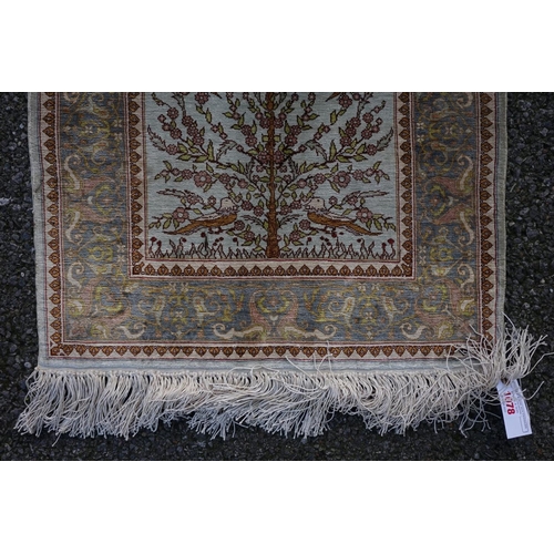 1078 - A small Persian silk prayer rug, decorated with birds, trees and flowers, 72cm x 52cm.... 