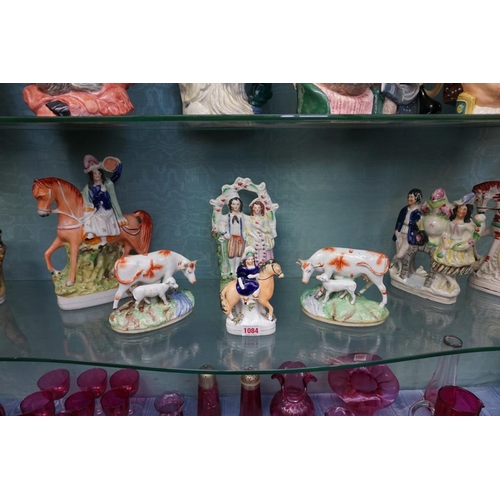 1084 - Eight Victorian Staffordshire pottery figure groups, to include: a horse back figure with leopard, p... 