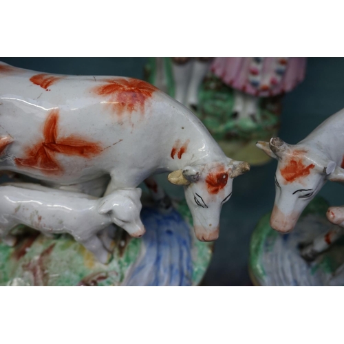 1084 - Eight Victorian Staffordshire pottery figure groups, to include: a horse back figure with leopard, p... 