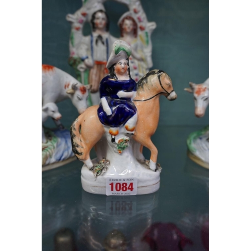 1084 - Eight Victorian Staffordshire pottery figure groups, to include: a horse back figure with leopard, p... 