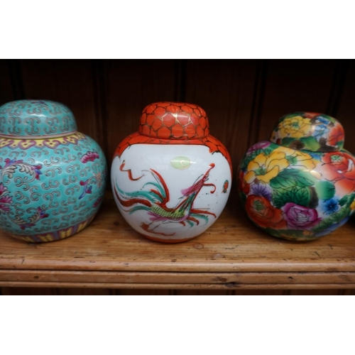 1087 - A collection of Chinese ginger jars, most with covers, largest 15cm high; together with four further... 