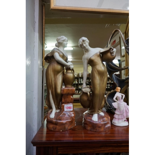 1090 - An Art Deco figure of a lady, 43cm high; together with another pair of pottery figures, 35cm high; a... 