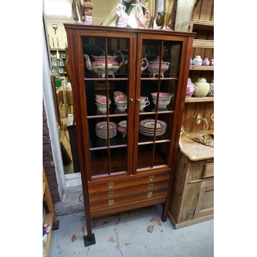 1091 - A reproduction rosewood display cabinet, with brass countersunk handles, 151cm high x 72cm wide.... 