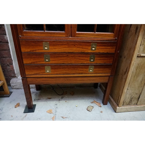 1091 - A reproduction rosewood display cabinet, with brass countersunk handles, 151cm high x 72cm wide.... 