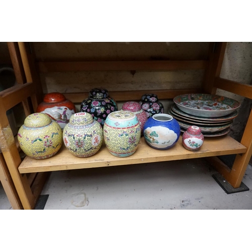 1100 - A collection of Oriental porcelain, to include ginger jars and covers.