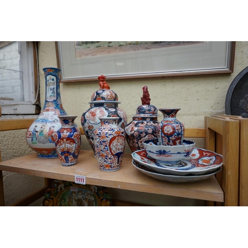 1111 - A collection of Japanese Imari porcelain, largest 33cm high. (9)