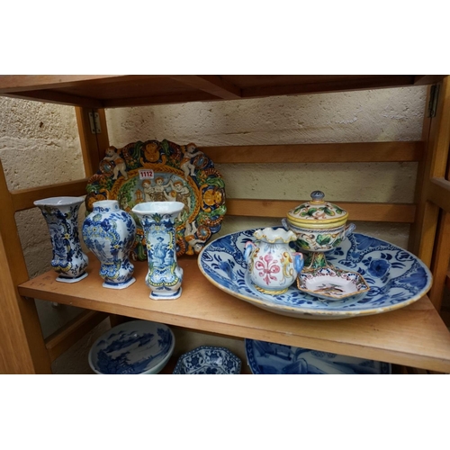 1112 - A collection of tin glazed pottery, to include: a maiolica plate, 29.5cm wide; and Delftware. (8)... 