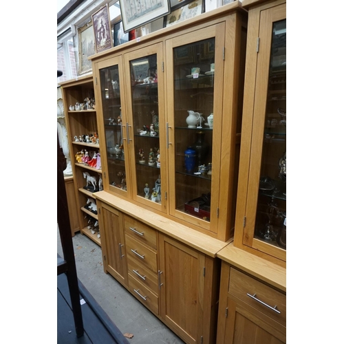 1125 - A contemporary pale oak cabinet, 130.5cm wide. 