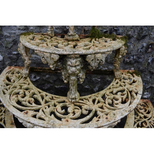 1717 - A pair of Victorian white painted cast iron four tier semi-circular plant stands, in the manner of C... 