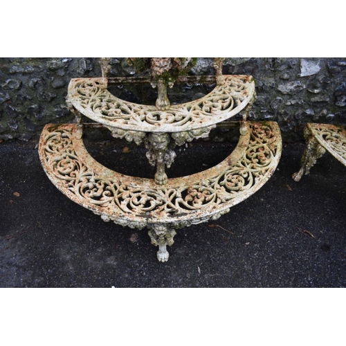 1717 - A pair of Victorian white painted cast iron four tier semi-circular plant stands, in the manner of C... 