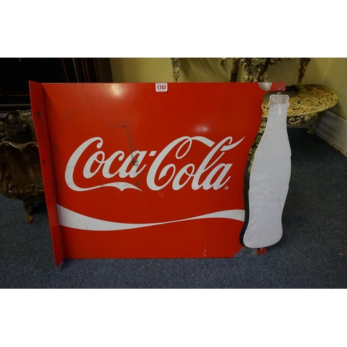 1743 - An aluminium Coca-Cola sign, with revolving 'bottle', 52.5 x 70cm.