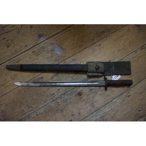 1748 - A 1907 Pattern bayonet and leather scabbard, made in 1917 by Lithgow, with canvas belt frog.... 