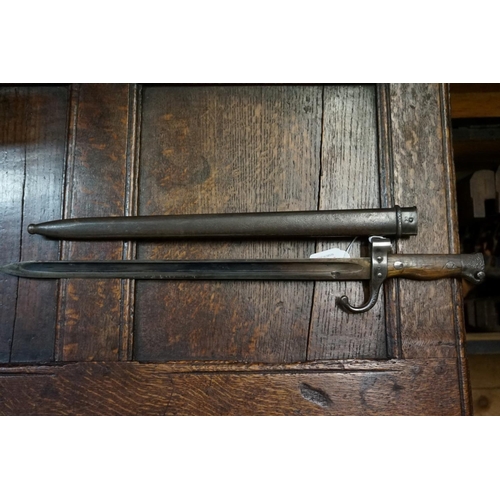 1755 - A bayonet and steel scabbard. 