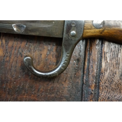 1755 - A bayonet and steel scabbard. 