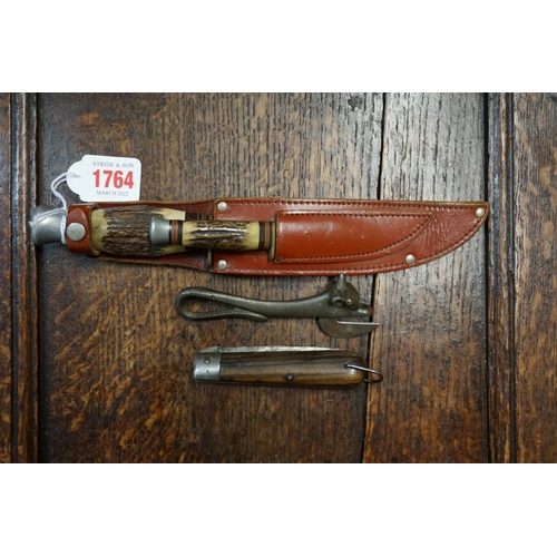 1764 - To small antler handled Bowie knives, in one leather sheath; together with an old folding knife; and... 