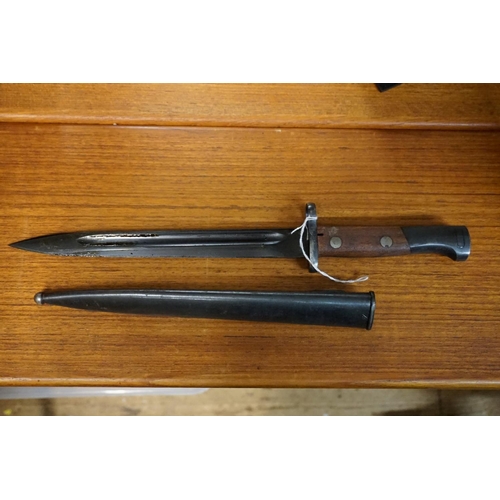 1768 - A Russian bayonet and steel scabbard; together with another bayonet and leather scabbard; and a spik... 