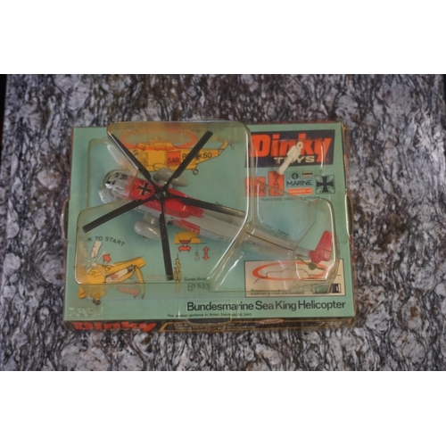 848 - Dinky: a group of four vintage Dinky, comprising: 721 Junkers JU 87B Stuka; 726 Messerschmitt B... 