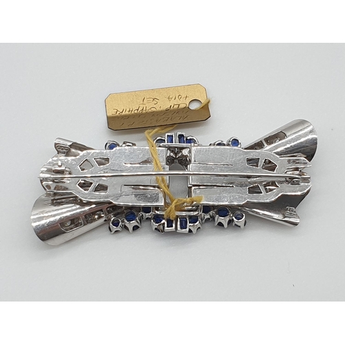 11 - (NB) A satin textured brooch/double clip set diamonds and sapphires, by Alabaster & Wilson, stam... 