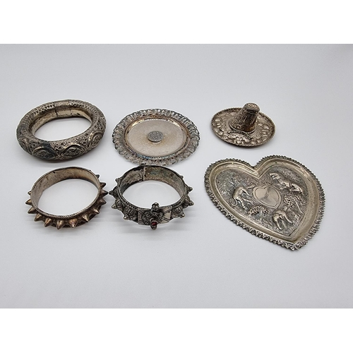 611 - Six various metal items; to include a .800 coaster and a Mexican hat, stamped 925.