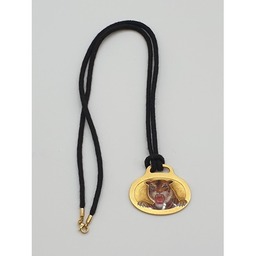 69 - (NB) A 1960s American yellow metal pendant, decorated with enamelled tiger's head, maker A G, stampe... 