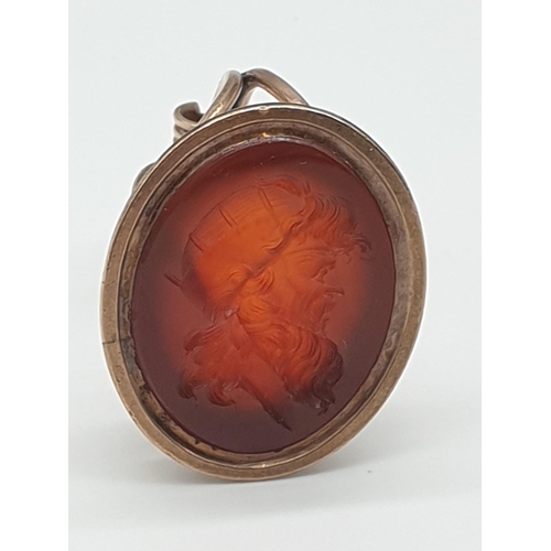 71 - (NB) A large Georgian yellow metal cornelian intaglio fob seal, depicting the face of a bearded man,... 