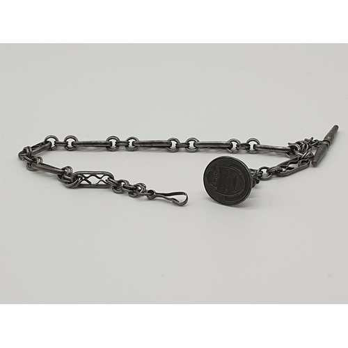 73 - (NB) An 18th century cut steel watch fob chain, 27cm; and an attached steel seal engraved the arms o... 