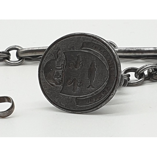 73 - (NB) An 18th century cut steel watch fob chain, 27cm; and an attached steel seal engraved the arms o... 